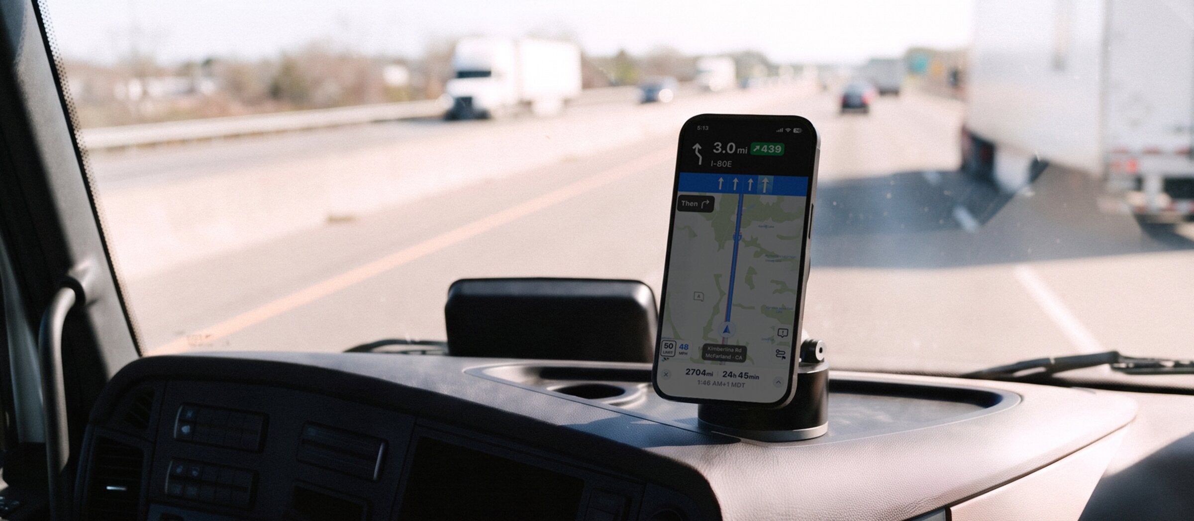 HyperMount holding a phone on a semi truck dashboard on the highway
