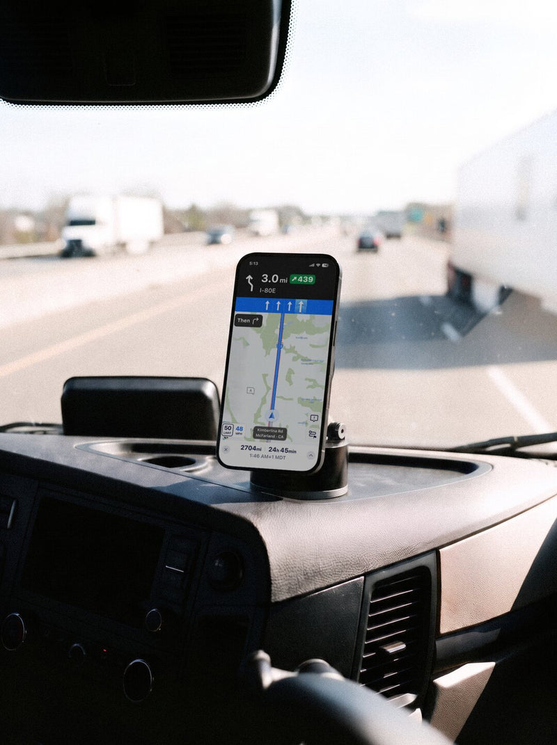 HyperMount holding a phone on a semi truck dashboard on the highway